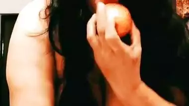 Desi Bhabhi inserting apple inside her pussy