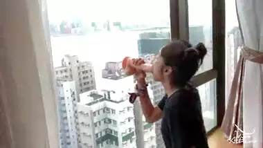 NAUGHTY DESI COLLEGE TEEN RIDES DILDO AGAINST HONG KONG SKYSCRAPER WINDOW