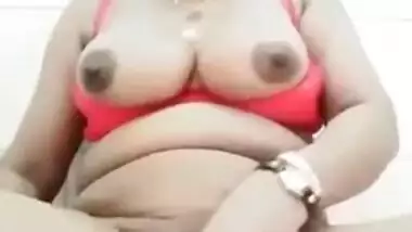 Fat Desi auntie sticks cucumber into pussy to satisfy her XXX needs