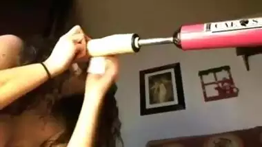 Brunette masturbates with a vibrator and a dildo machine