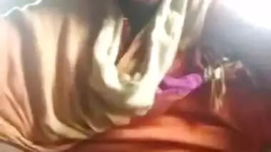 Attractive Indian teen demonstrates pussy while filming porn in garage