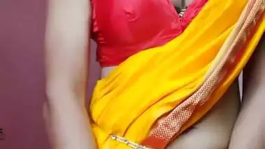 Indian shemale enjoys strip teasing and masturbating