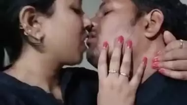 Sexy couple smooching in office