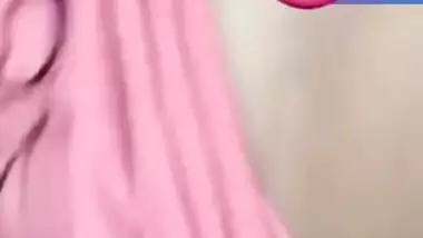 Pretty Desi woman lifts pink top to show boobs during the porn video call