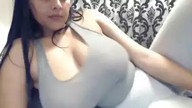 Busty Indian teen shaking massive tits in webcam