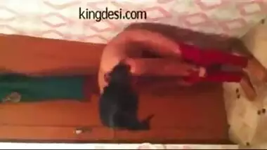Indian wife taking bath in front of her servant