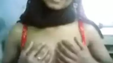 Hot Indian chick taking her clothes off and...