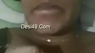 Indian aunty with sexy full lips takes big natural boobs out in bed