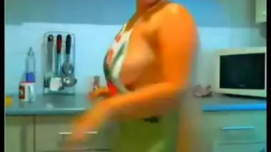 Nri chubby housewife in kitchen