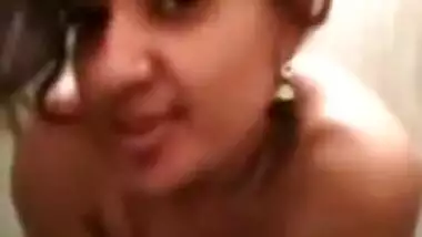 Desi girl poses on XXX camera before starting a shower sex show