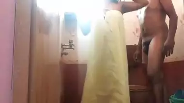 Amateur Indian sex video where man fucks wife from behind in bathroom