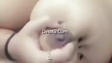 Stunning Desi sexpot plays with her massive natural XXX tits on camera