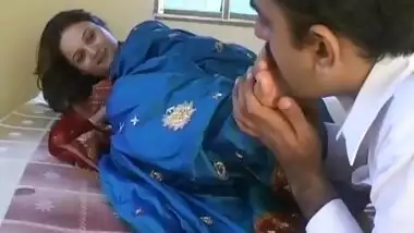 Mustached Indian man worships feet of girl in blue dress in XXX video