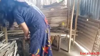 Bihari babu pounds his malkin outdoors in a hut