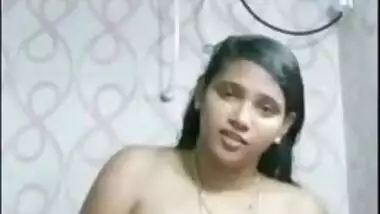 Indian girl with juicy melons satisfies pussy in the shower room