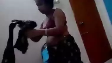 Beautiful Indian wife dress changing and peeing