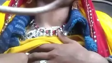 Desi chick pulls her bright dress up to demonstrate big XXX boobs