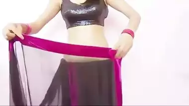 young girl teaching how to wear saree 1