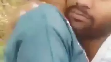 Indian outdoor sex of a guy sucking his GF’s tight boobs