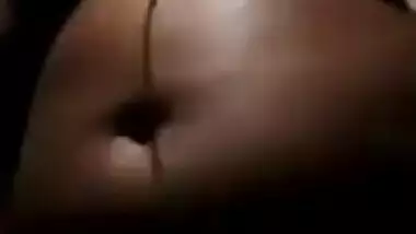 Indian MILF exposes succulent XXX boobies in the dark of the bedroom