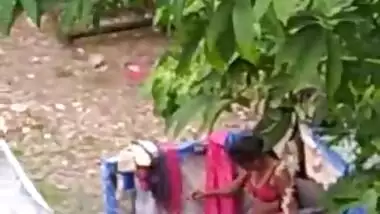 Indian girl bathing outdoor