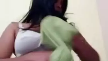 Indian takes a green sari off and exposes her XXX jugs on sex camera