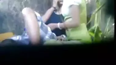 Two lesbian girls fingers each other in the public place