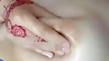 Desi female with tattooed hands receives pleasure touching chest