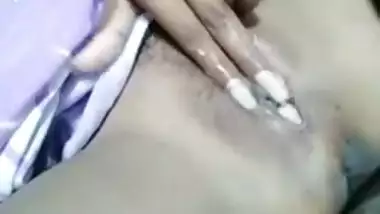 Girl masturbates and fingers her own pussy in the Desi amateur video