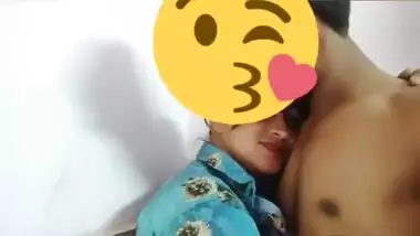 Desi girl in floral shirt kisses porn partner being covered with a smile