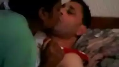 young couple kissing in bedroom