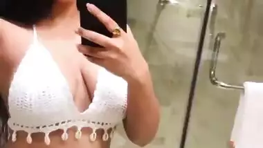 Sexy babe white bikini cleavage and deep navel