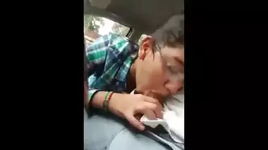 Indian porn mms of a slutty teen giving a blowjob to lover in his car