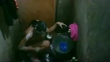 Bangladeshi young girl taking shower.