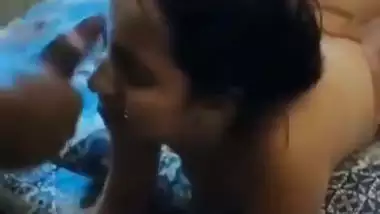 A girl gets cum on her face in an Indian threesome blue film